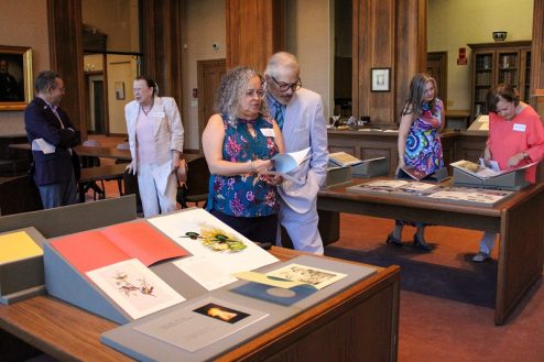 Guests peruse the items on display in the McIlhenny Room of Hill Memorial Library, including FOLL-related items and items purchased with FOLL funds.