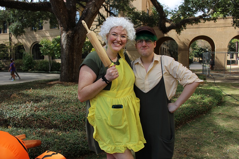 two costumed individuals outdoors in the LSU quad