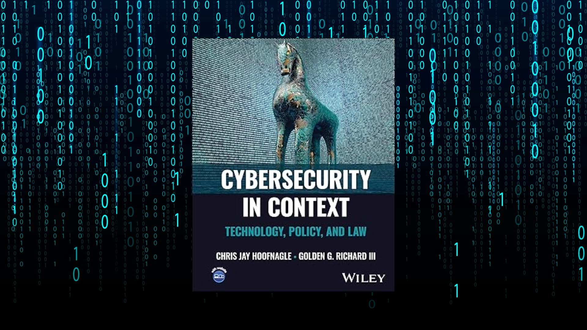 The book cover for Cybersecurity in Context: Technology, Policy, and Law overlaid onto a background of cascading computer code