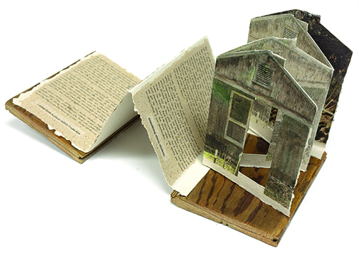 Artist book Poule Aye by Alisa Banks. Book is shaped like a house.