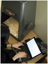 Project Graduate Assistant, Laura Charney, collects data from each microfilmed page to determine the feasibility of digitizing the reel.