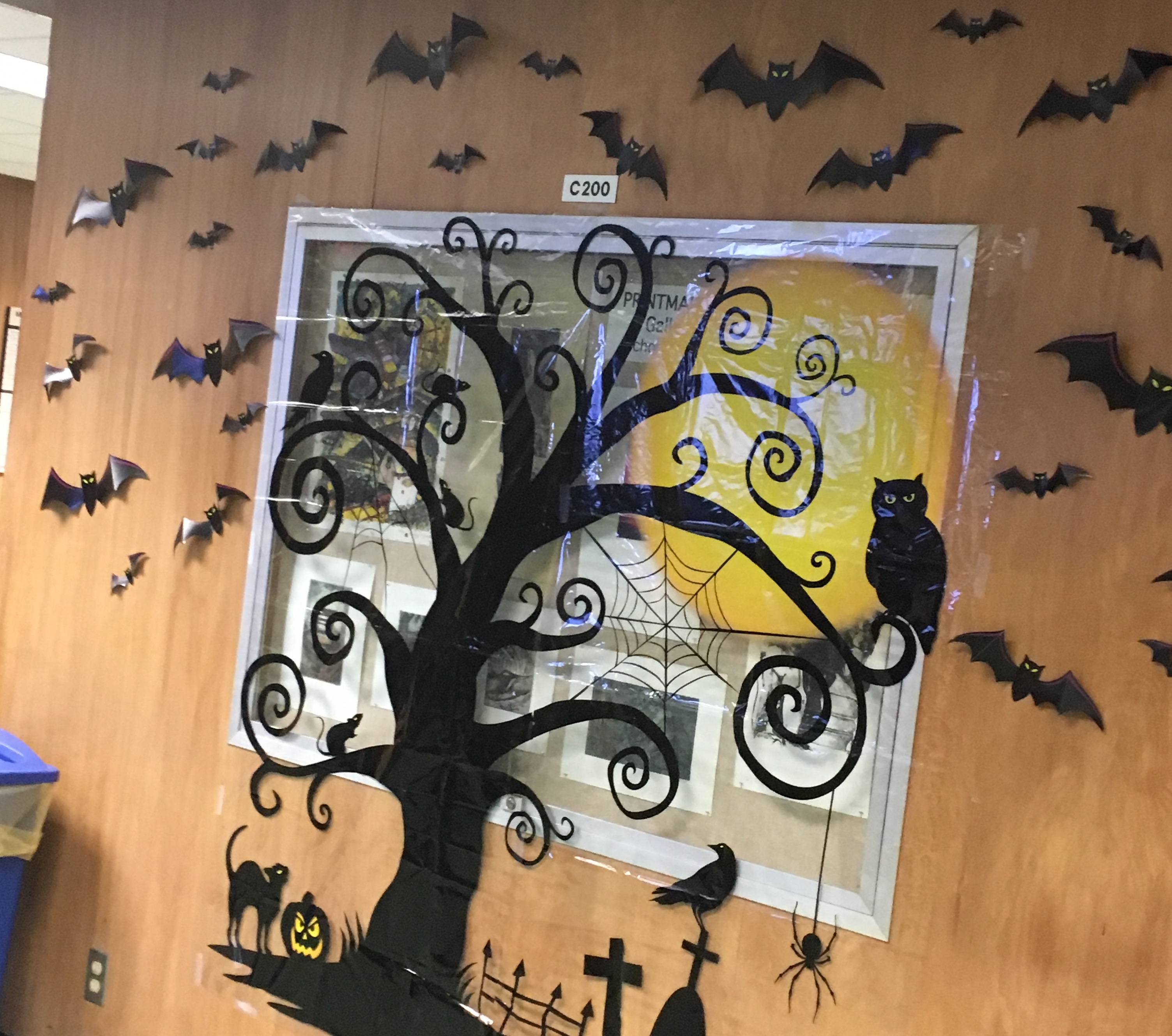 a spooky tree and bats adorn a wall of LSU library